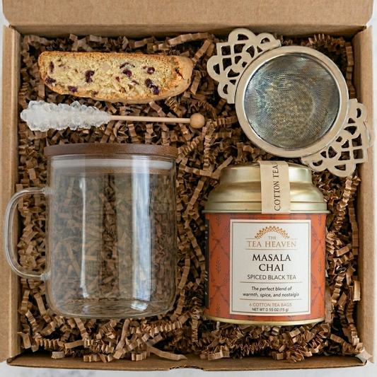 Gift set with tea mug, loose leaf tea canister, and tea accessories in a box