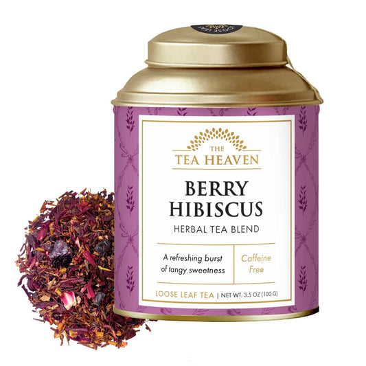 Tea canister labeled 'Berry Hibiscus' from The Tea Heaven with loose leaf tea displayed.