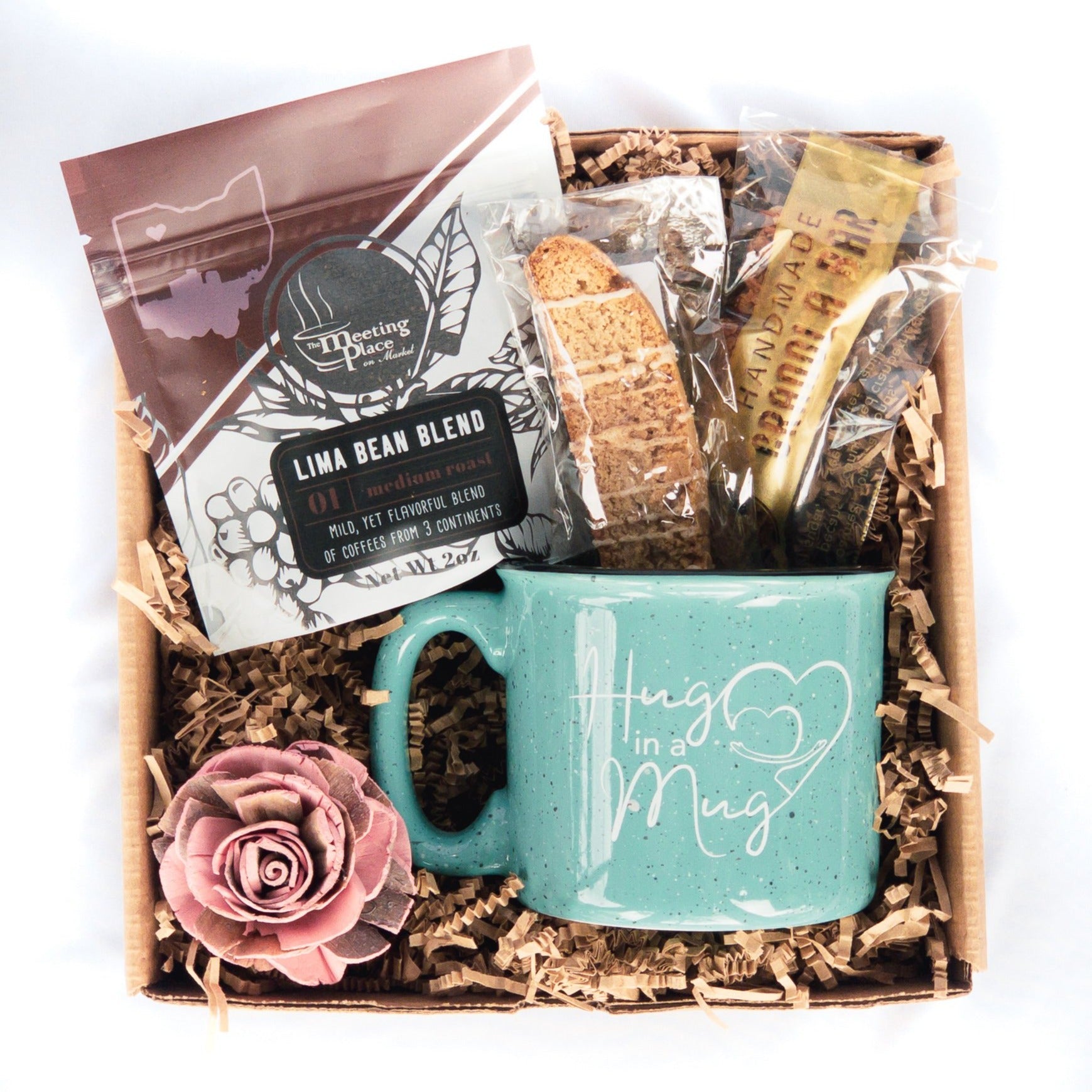 https://meetingplaceonmarket.com/cdn/shop/products/mothers-day-gift-box-hug-in-a-mug-with-gourmet-coffee-317837.jpg?v=1690483834&width=1946